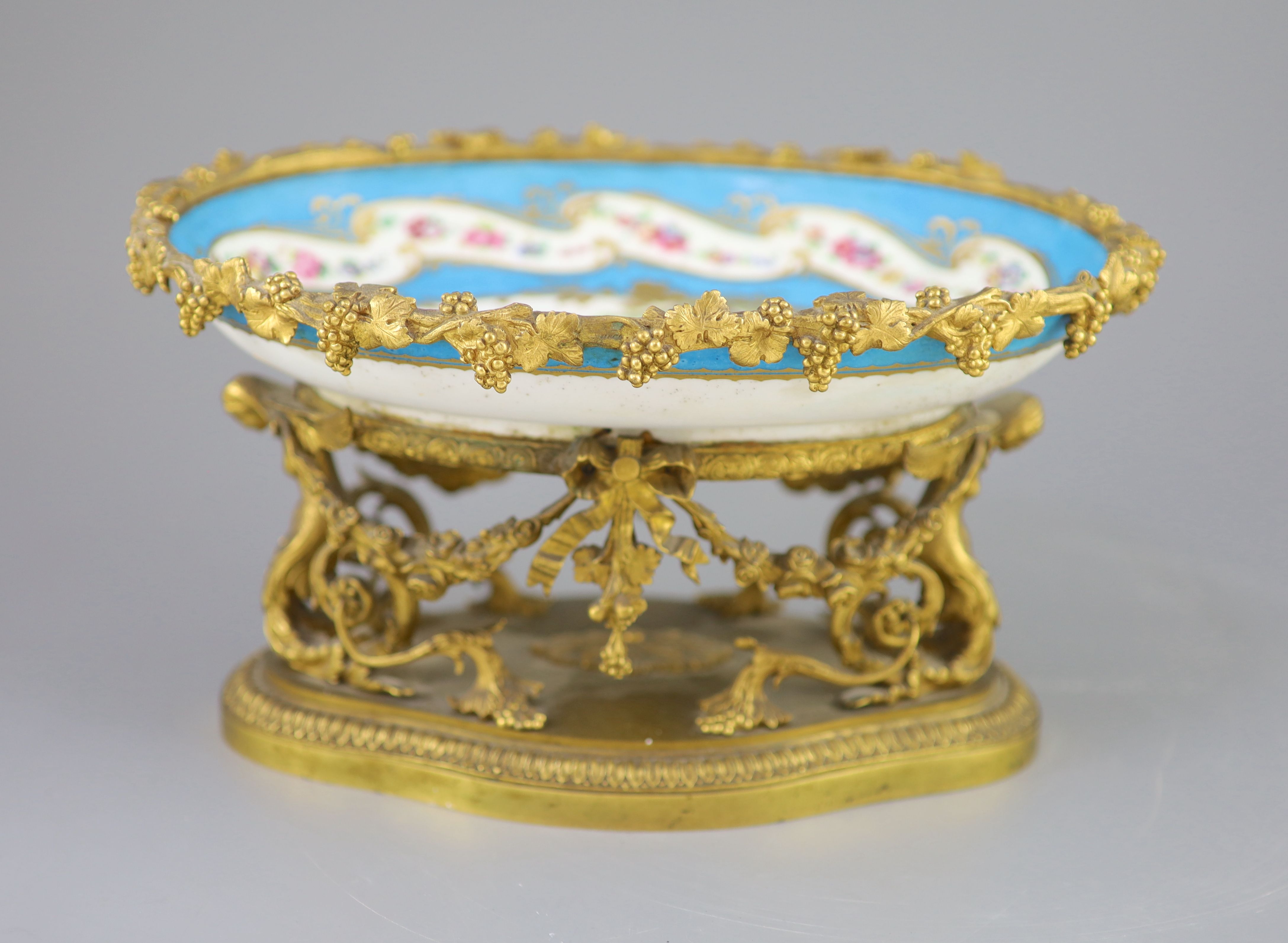A French Sevres style porcelain and ormolu mounted oval centrepiece dish, 19th century, 28.5cm across